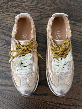 Gold/silver Leather Sneaker with Cream Laces.    Never worn